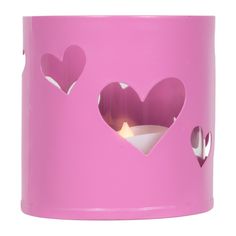 a pink cup with hearts cut out of it