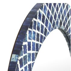 a blue and white tile arch mirror frame