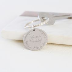 a keychain that has some writing on it