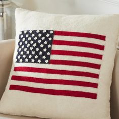 an american flag pillow on a couch