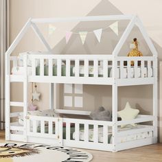 a white bunk bed sitting on top of a wooden floor