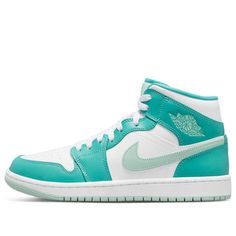 Introducing the new Women's Air Jordan 1 Mid Marine Green sneakers. A bold offering from Jordan brand, these shoes proudly symbolize the legacy of Michael Jordan and his original Air Jordan 1s from 1985. Crafted with high-top construction and white laces, these sneakers feature island green highlights that subtly stand out against the predominantly white upper. Core details like the Nike Swoosh on the side, the Air Jordan logo on the outer ankle, and Jumpman logo on the tongue complete for a modern look that is steeped in tradition. The sleek design of the Women's Air Jordan 1 Mid Marine Green successfully combines style with substance for a sneaker worthy of any look. (AJ1/SNKR/Retro/Mid Top/Women's/Basketball) Air Jordan Logo, Green Jordans, Original Air Jordans, Wmns Air Jordan 1, Air Jordans Women, Air Jordan 1s, Jordan Logo, Preppy Shoes, Dream List