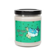 a white jar with a green label that says self care bear on it