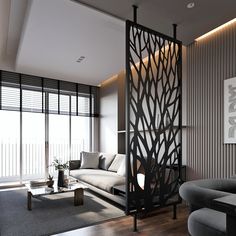 the living room is decorated in black and white with wood accents, along with modern furniture