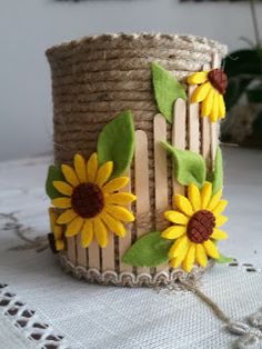 a close up of a bracelet with sunflowers on it