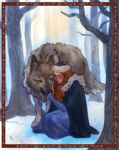 a woman sitting in the snow with a wolf on her lap next to her chest