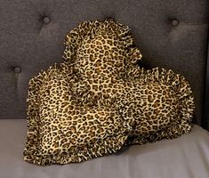 a leopard print blanket on top of a bed