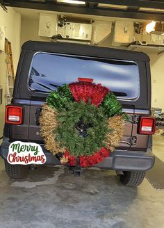 a christmas wreath on the back of a jeep