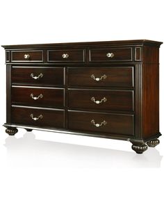 a large wooden dresser with many drawers and knobs on the top drawer, against a white background