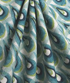 a blue and green fabric with circles on it