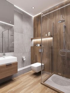 a modern bathroom with wooden floors and walls, along with a glass shower door on the wall