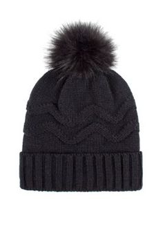 a black hat with a fur pom