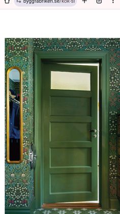 a green door in front of a mirror