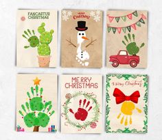 four christmas cards with hand prints on them