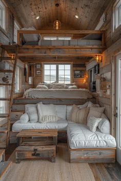 a living room filled with furniture next to a wooden wall and ceiling mounted bunk bed