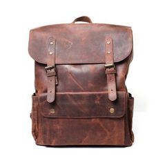 Dark brown leather backpack Vintage Brown Leather Backpack For Daily Use, Classic Brown Rectangular Backpack, Classic Brown Leather Backpack For Travel, Classic Brown Leather Travel Backpack, Brown Leather Business Backpack, Luxury Brown Backpack With Leather Backing, Brown Business Backpack With Adjustable Strap, Luxury Brown Leather Backpack With Waxed Finish, Brown Business Backpack