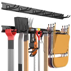 an assortment of tools hanging on the wall