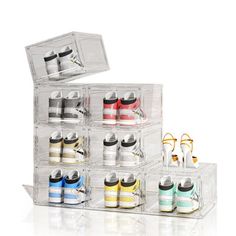 an acrylic display case with twelve pairs of shoes in each compartment and one shoe on the other side