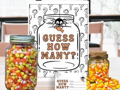 a jar filled with candy corn next to a coloring book