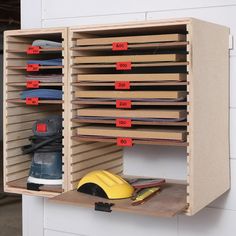 a pair of work shoes are sitting in a shoe rack with numbered labels on it