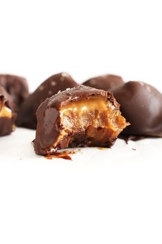 chocolate covered candy sitting on top of a white surface