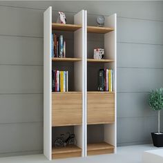 a bookshelf with two shelves and a bike on the floor next to it