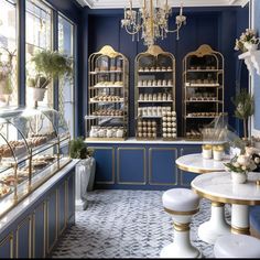 the interior of a bakery with blue walls and gold trim