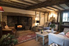 a living room filled with furniture and a fire place