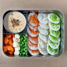 a metal container filled with different types of food