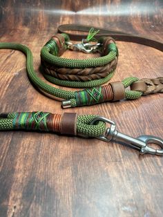 a green leash with braiding on it sitting on a wooden table next to a pair of scissors