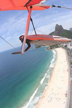 a man is para sailing over the ocean