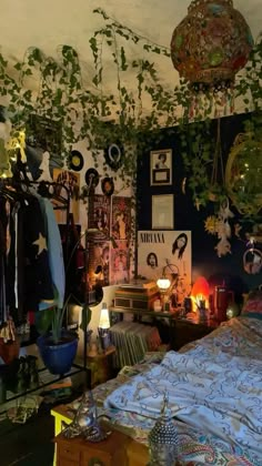 a bedroom with plants hanging from the ceiling