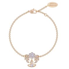 Inspired by antique Victorian diamond jewellery, Vivienne welcomes the ultra-feminine Amma Bracelet. Elegantly designed to simulate a flower, the bracelet is detailed with encrusted hand set white cubic zirconia, beautifully set upon a golden coated brass, completed with the signature hanging Orb. Composition: Brass. Color: gold metallic Charm measurement: 2cm H, 2cm W Bracelet measurement: Length adjustable, 6-7 inch. Come with Vivienne Westwood pouch:) US FAST SHIPPING. Saturn Bracelet, Westwood Jewellery, Vivian Westwood, Vivienne Westwood Earrings, Empress Dowager, Ultra Feminine, Delicate Chain, Diamond Jewellery, Measurement Length