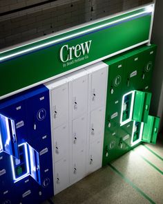 a row of lockers sitting next to each other in front of a green and white sign