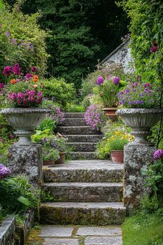 an outdoor garden with flowers and steps leading up to the entrance way, surrounded by greenery