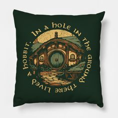 a green pillow with the words in a hole in the ground