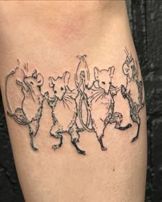 a group of mice tattoo on the side of a woman's leg with black ink