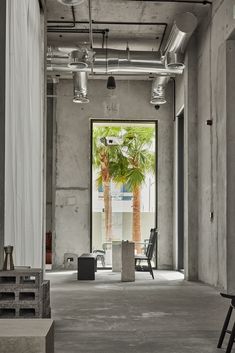 Green velvet sofa with large white curtain Cement Coffee Shop, Brutalist Cafe, Brutalism Architecture Interior, Brick Cafe, Brutalist Interior, Coffee House Design, Culture Aesthetic, Industrial Cafe