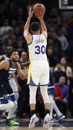 the basketball player is trying to dunk the ball