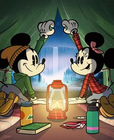 two mickey mouses standing next to each other in front of a lantern and books