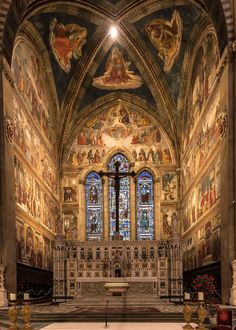 the inside of a church with paintings on the walls