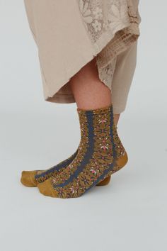 Keep your feet warm and stylish with our Garden Stitch Socks, these will add such a cute boho touch to your cold weather looks and get so many compliments! So cozy, medium-weight, fabric with so cute floral mix print Beautiful multi-color yarn throughout Perfect for everyday wear for warmth and boho style Pair with: Eye Of The Sun Padded Bralette, Ethereal Shine Stacked Bracelet and Dreamscape Layered Necklace. *Due to lighting and differences in monitors, actual colors may vary slightly from wh Stitch Socks, Boho Essentials, Bralette Outfit, Padded Bralette, Layered Necklace, Mixing Prints, Yarn Colors, Sock Shoes, Layered Necklaces