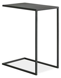 a white side table with a metal frame