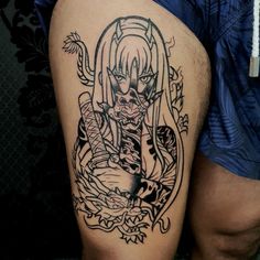 a man with a tattoo on his thigh