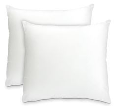 two white pillows sitting next to each other