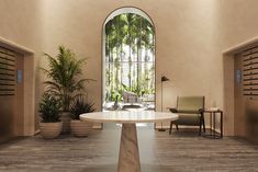 a table in a room with chairs and potted plants on either side of it