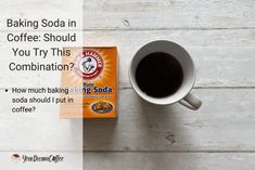 a box of baking soda next to a cup of coffee