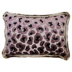 a pink and black leopard print pillow with fur trimming on the bottom, along with an animal print border