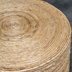 a close up view of the top of a wicker basket with circular design on it