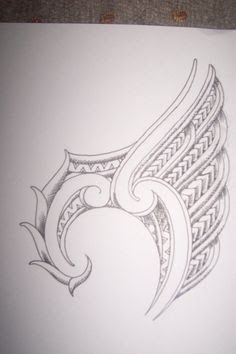 a drawing of an angel's wing on white paper